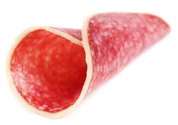 Rebanada de salami aislada sobre fondo blanco — Foto de Stock