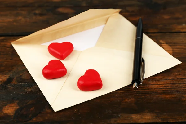 Envelope with hearts and pen Stock Photo