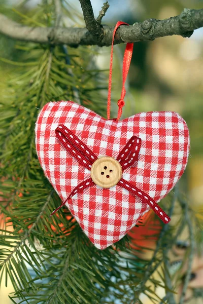 Tree branch with heart decoration on nature background — Stock Photo, Image