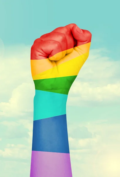 Man's hand painted as the rainbow flag on sky background — Stock Photo, Image