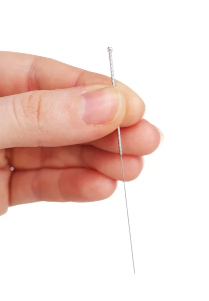 Hand holding needle for acupuncture on hand, close up. Isolated on white — Stock Photo, Image