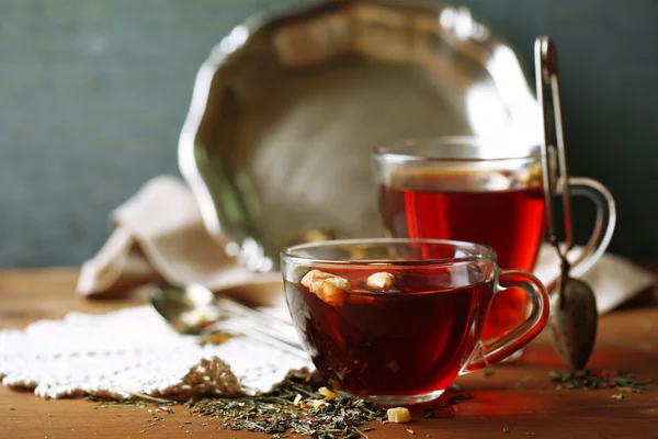 Beautiful vintage composition with herbal tea, on wooden table — Stock Photo, Image