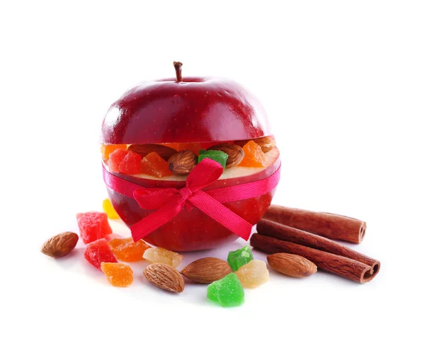 Red apple stuffed with dried fruits with cinnamon and almond isolated on white — Stock Photo, Image