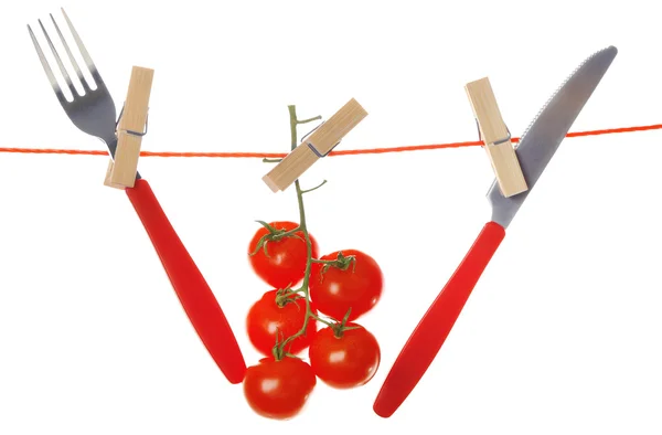 Vork, mes en rijpe rode tomaten — Stockfoto