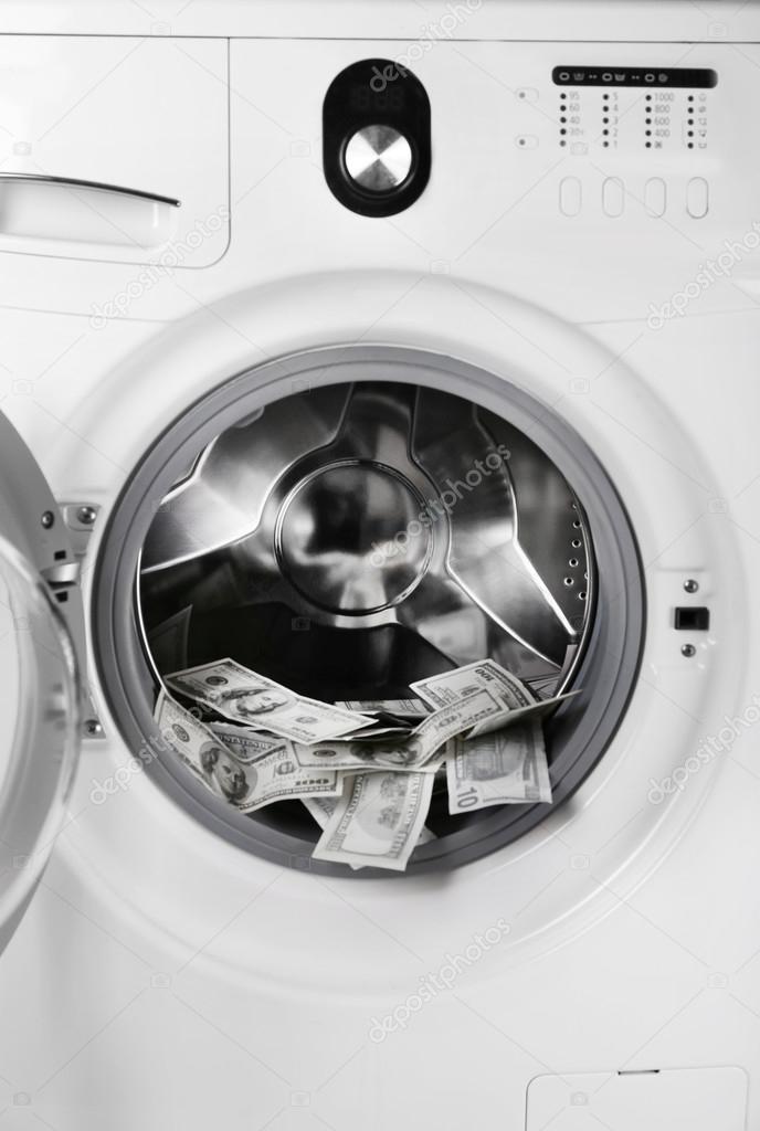Money in washing machine, closeup view