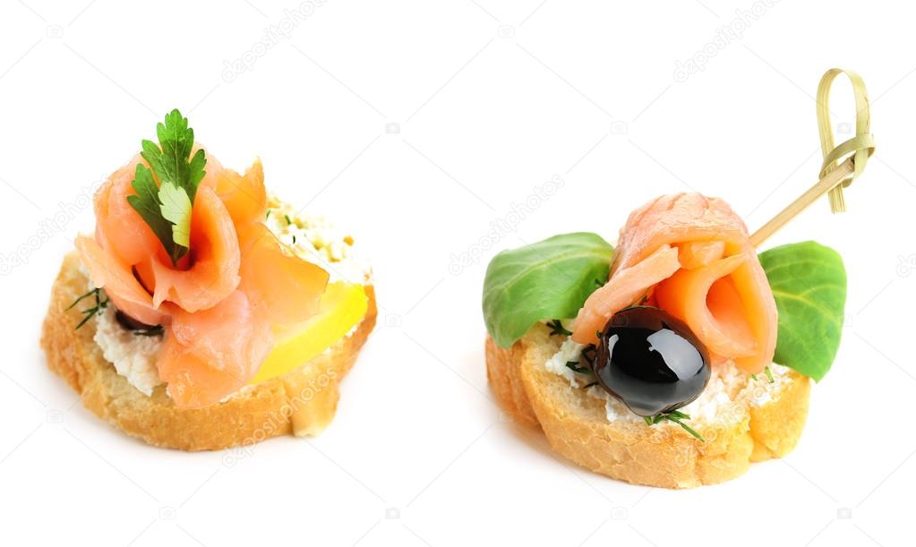 Canapes with salmon and herbs isolated on white