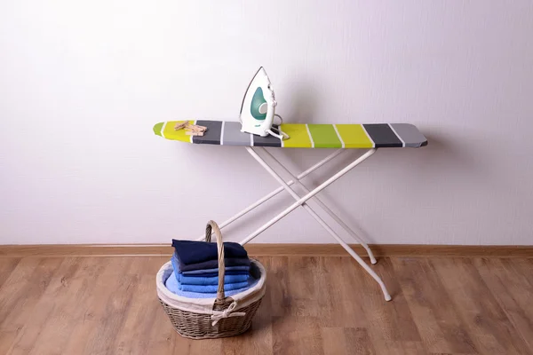 Ironing board with laundry — Stock Photo, Image