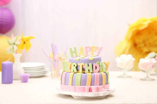 Delicious birthday cake on table on bright background — Stock Photo, Image