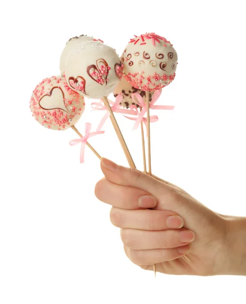 Female hand holding cake pops — Stock Photo, Image