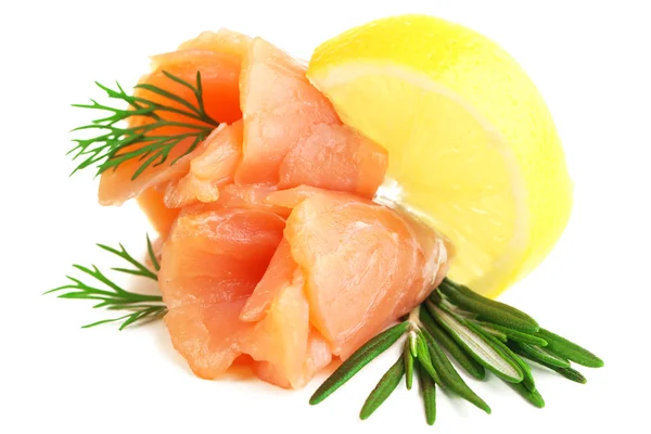 Sliced and rolled salmon  with lemon slice on salad leaf  isolated on white — Stock Photo, Image