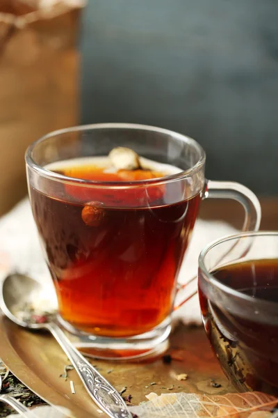 Beautiful vintage composition with herbal tea, on wooden table — Stock Photo, Image