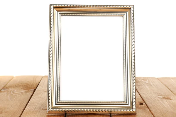 Moldura da foto na mesa de madeira isolada no branco — Fotografia de Stock