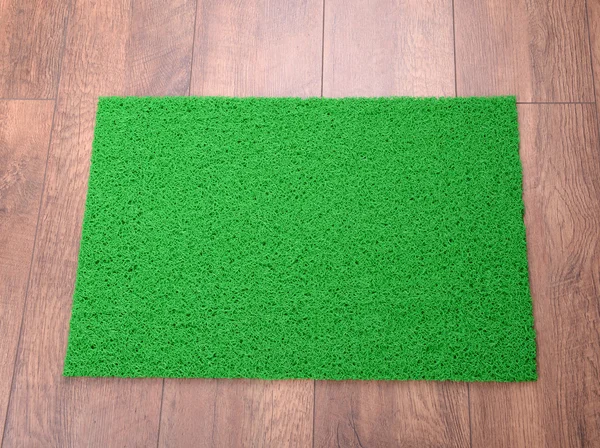 Зеленый ковер на полу крупным планом — стоковое фото