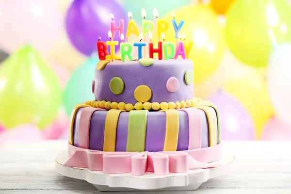 Delicious birthday cake on bright background — Stock Photo, Image