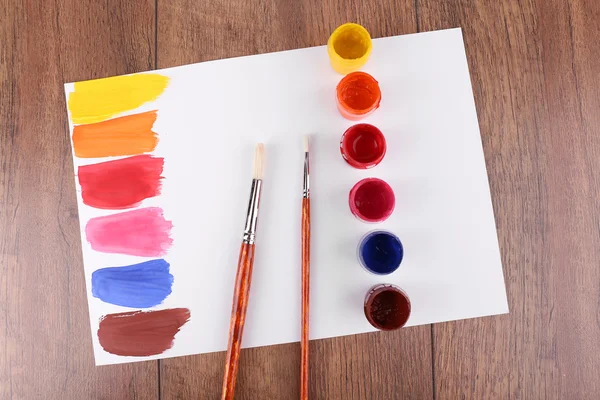 Paint strokes with brush and paint cans — Stock Photo, Image