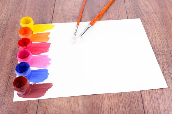 Paint strokes with brush and paint cans — Stock Photo, Image