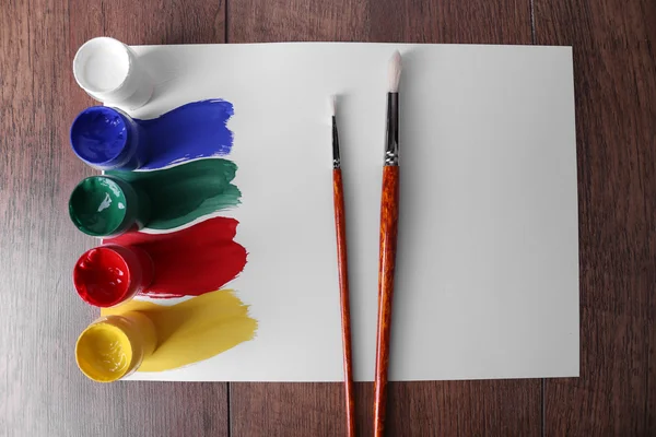 Paint strokes with brush and paint cans — Stock Photo, Image