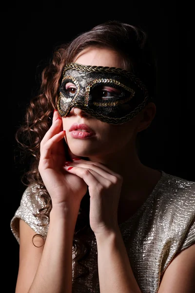 Beautiful girl with masquerade mask on dark background — Stock Photo, Image