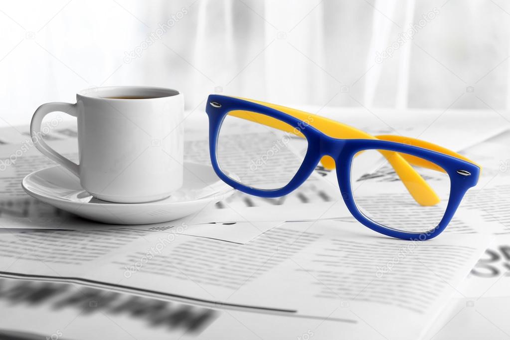 Glasses and newspapers