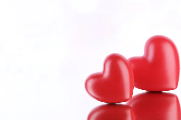 Red hearts on light background — Stock Photo, Image