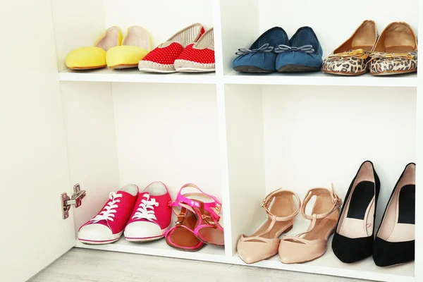 Collection of shoes on shelves — Stock Photo, Image