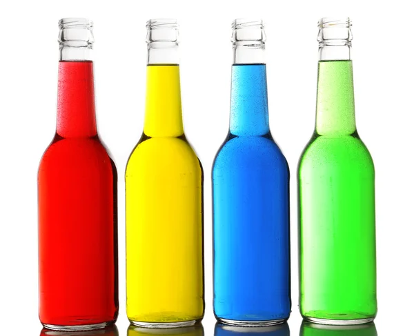 Colorful alcoholic beverages in glass bottles isolated on white — Stock Photo, Image