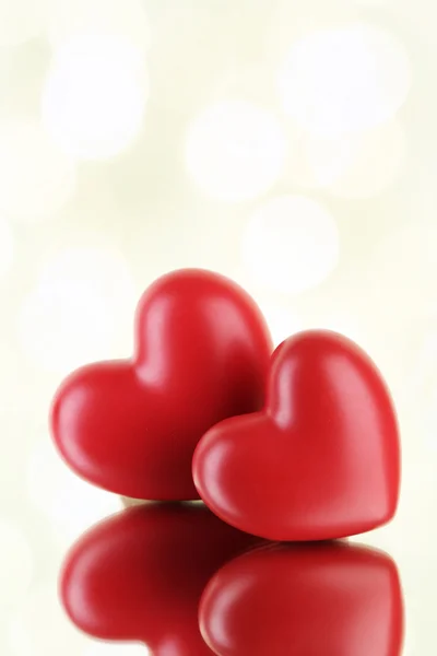 Red hearts on light background Royalty Free Stock Photos