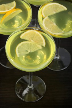 Glasses of fruit cocktails on table close-up