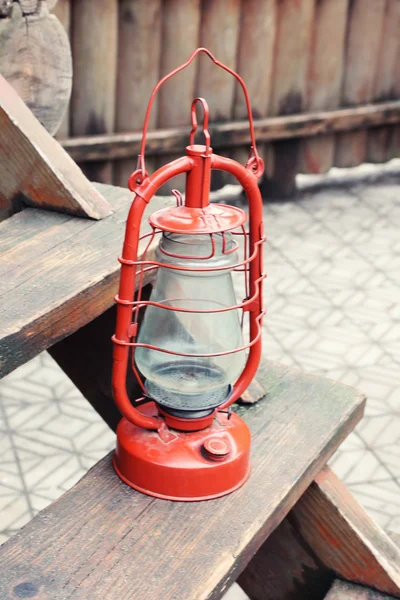 Kerosene lamp on wooden stairs, outdoors — Stock Photo, Image