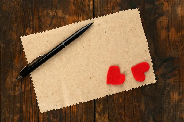 Carta con penna e due orecchie — Foto Stock
