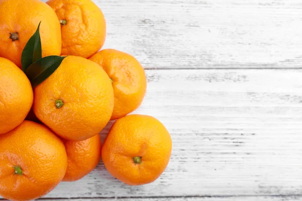 Tangerines on wooden background — Stock Photo, Image