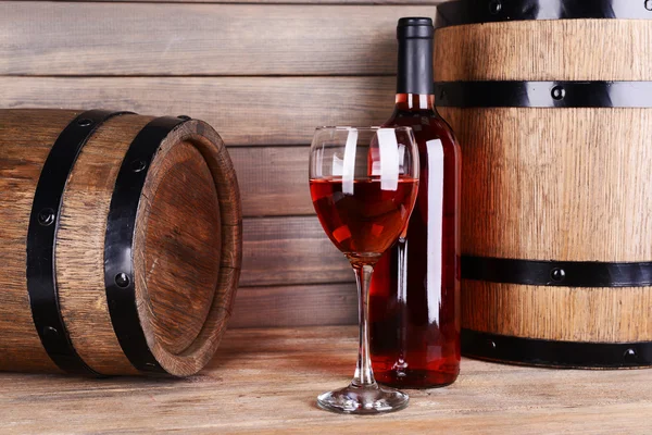 Red wine on table on wooden background — Stock Photo, Image