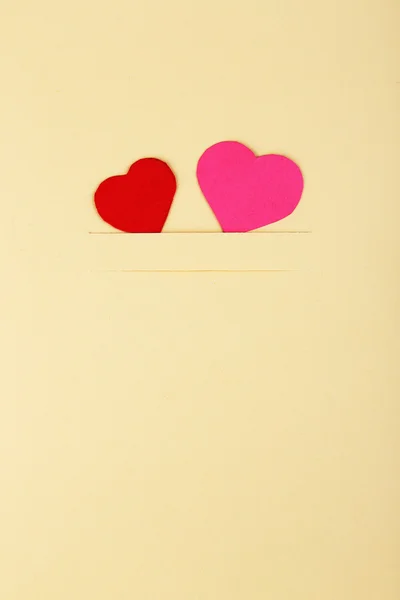 Paper hearts on beige — Stock Photo, Image