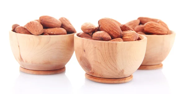 Almond in wooden bowls, isolated on white — Stock Photo, Image