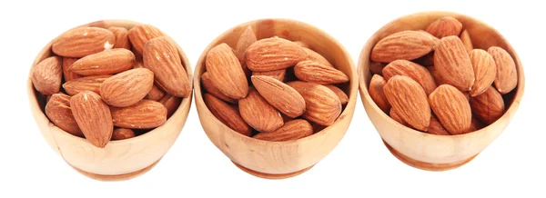 Almond in wooden bowls, isolated on white — Stock Photo, Image