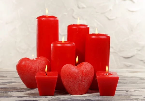 Beautiful candles on table on grey background — Stock Photo, Image