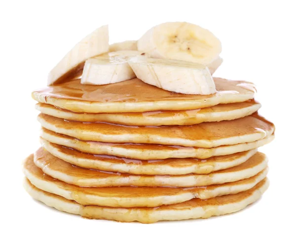 Stack of delicious pancakes with slices of banana and honey on plate isolated on white — Stock Photo, Image