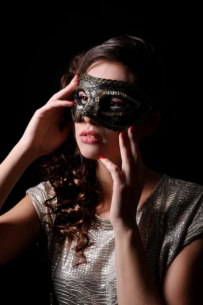 Beautiful girl with masquerade mask on dark background — Stock Photo, Image