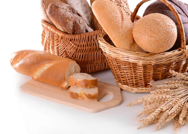 Different bread in wicker baskets isolated on white — Stock Photo, Image