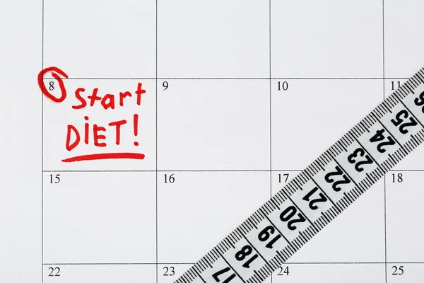 Diet concept - measure tape on calendar, close up — Stock Photo, Image