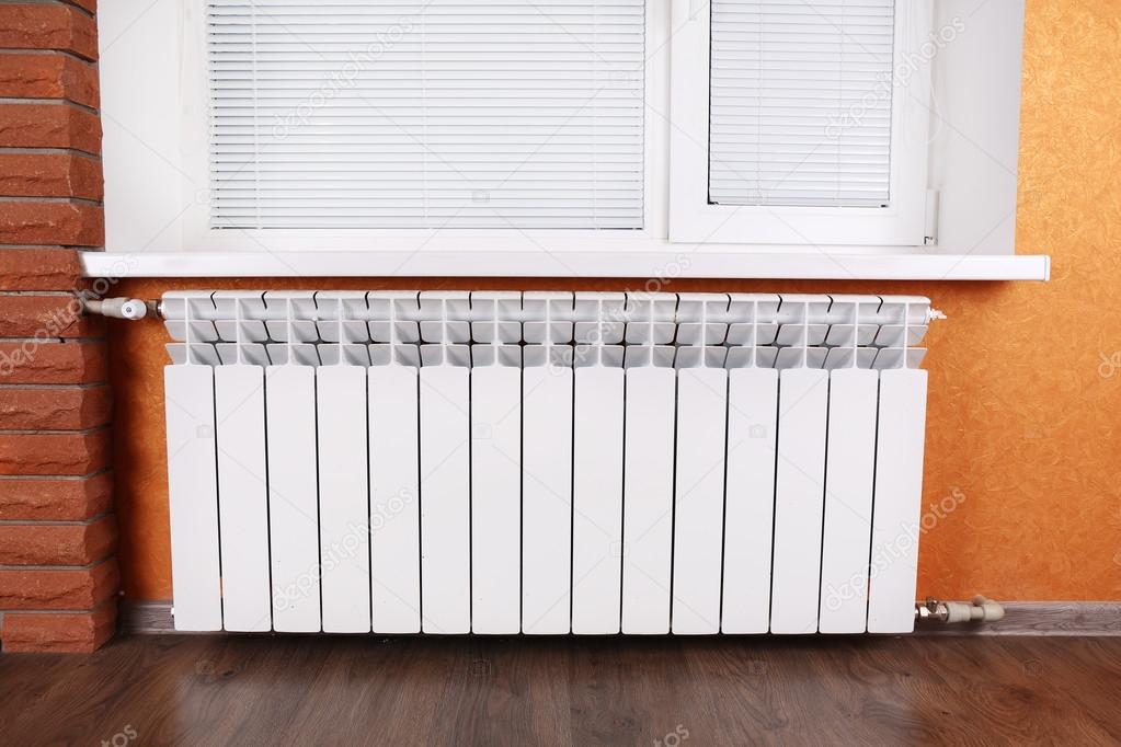 Heating radiator in room — Stock Photo © belchonock 62570269