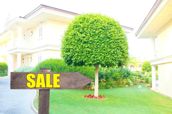 Home for sale Real estate sign in front of new house — Stock Photo, Image