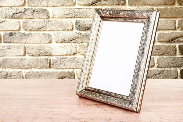 Moldura da foto na mesa de madeira — Fotografia de Stock