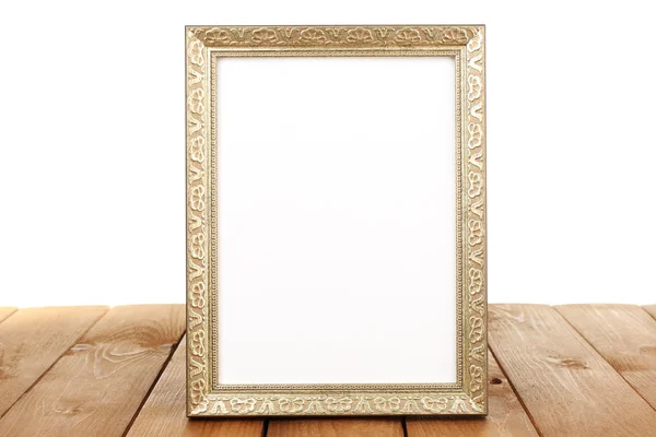 Photo frame on wooden table — Stock Photo, Image