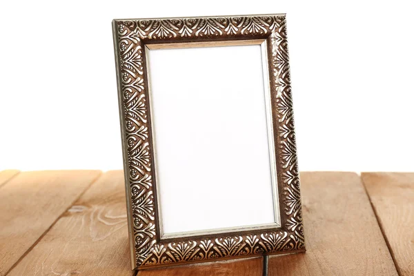 Photo frame on wooden table — Stock Photo, Image