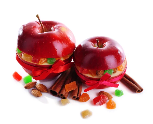 Red apples stuffed with dried fruits with cinnamon and almond isolated on white — Stock Photo, Image