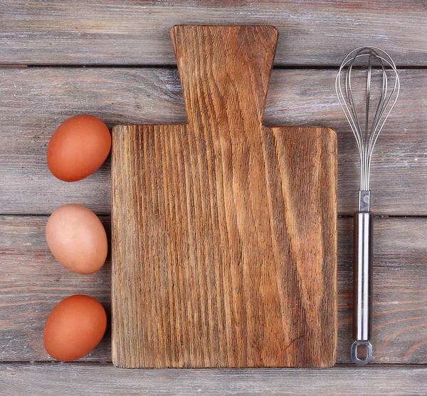 Cutting board with eggs — Stock Photo, Image