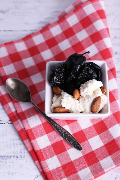 Dessert with prunes and almonds — Stock Photo, Image
