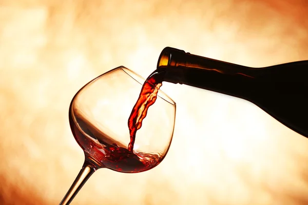 Pouring red wine