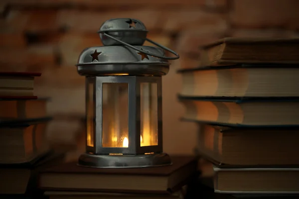 Books and decorative lantern — Stock Photo, Image